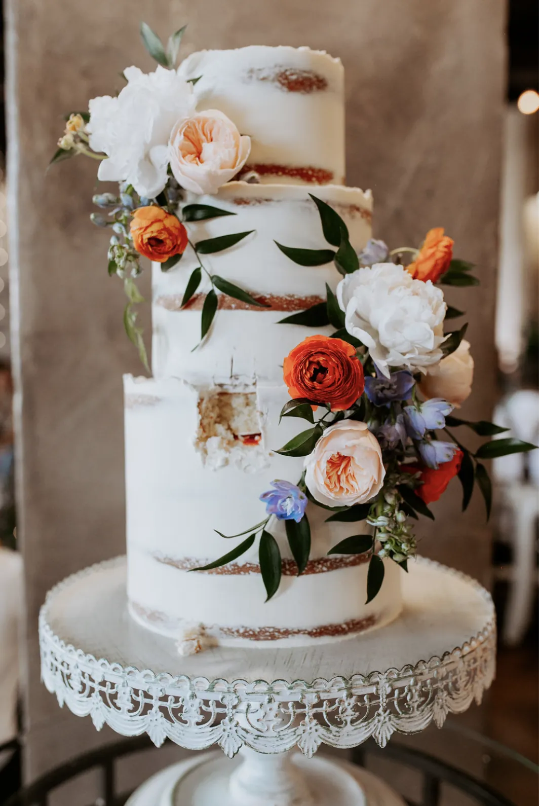 Naked wedding cake with fresh flowers