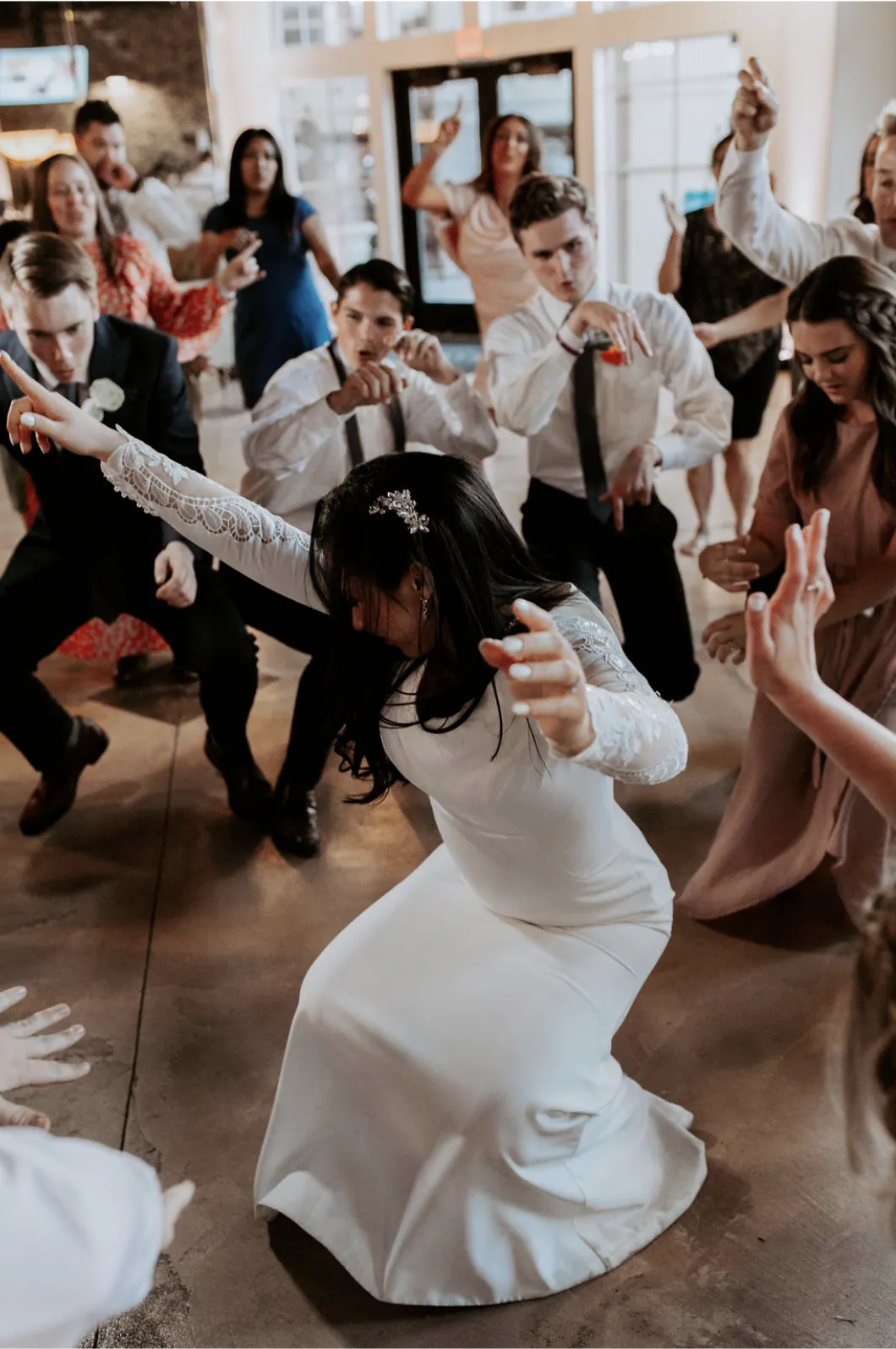 Bride getting low on a packed dance floor