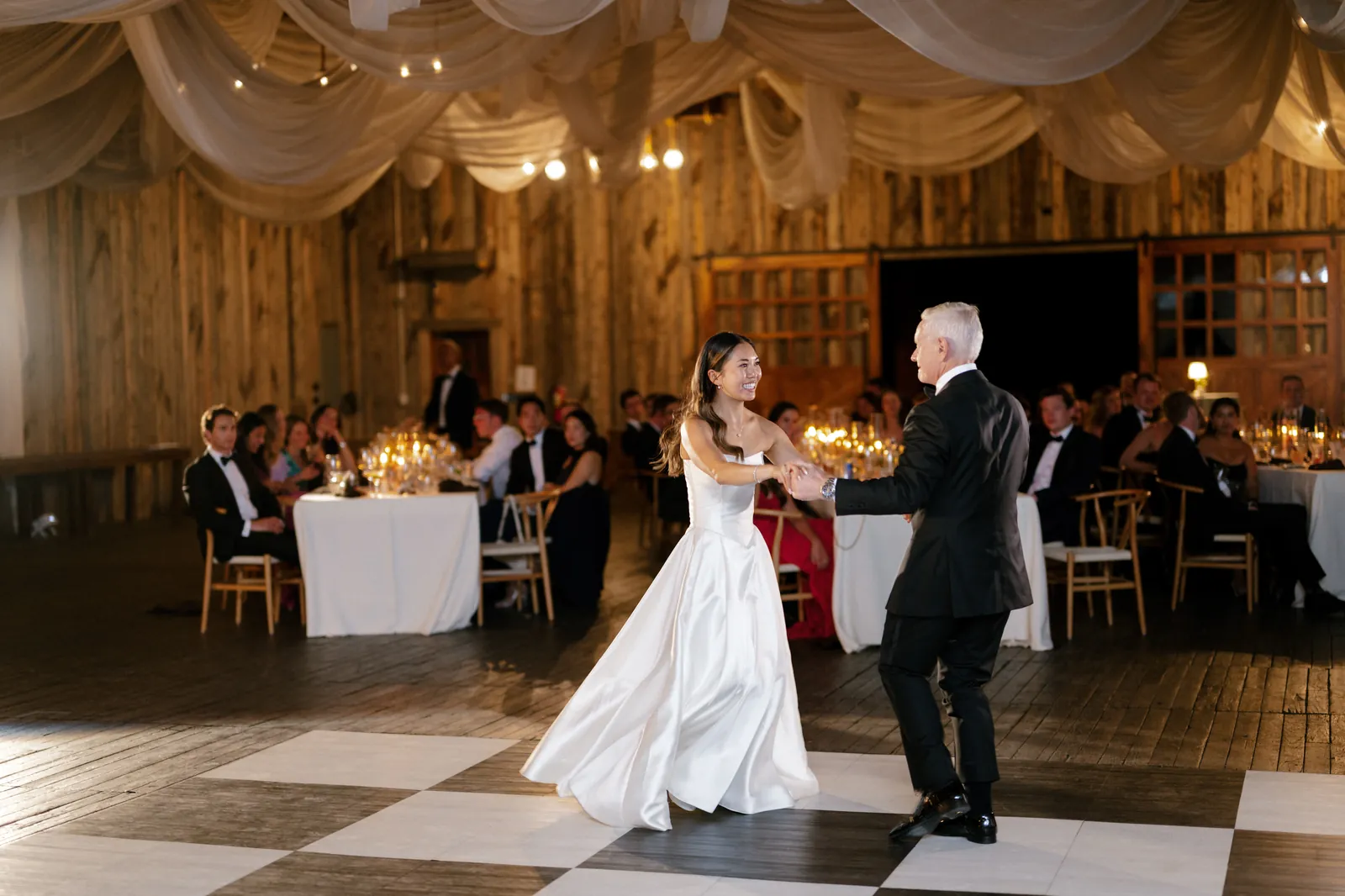 Father-daughter dance on a checkered floor