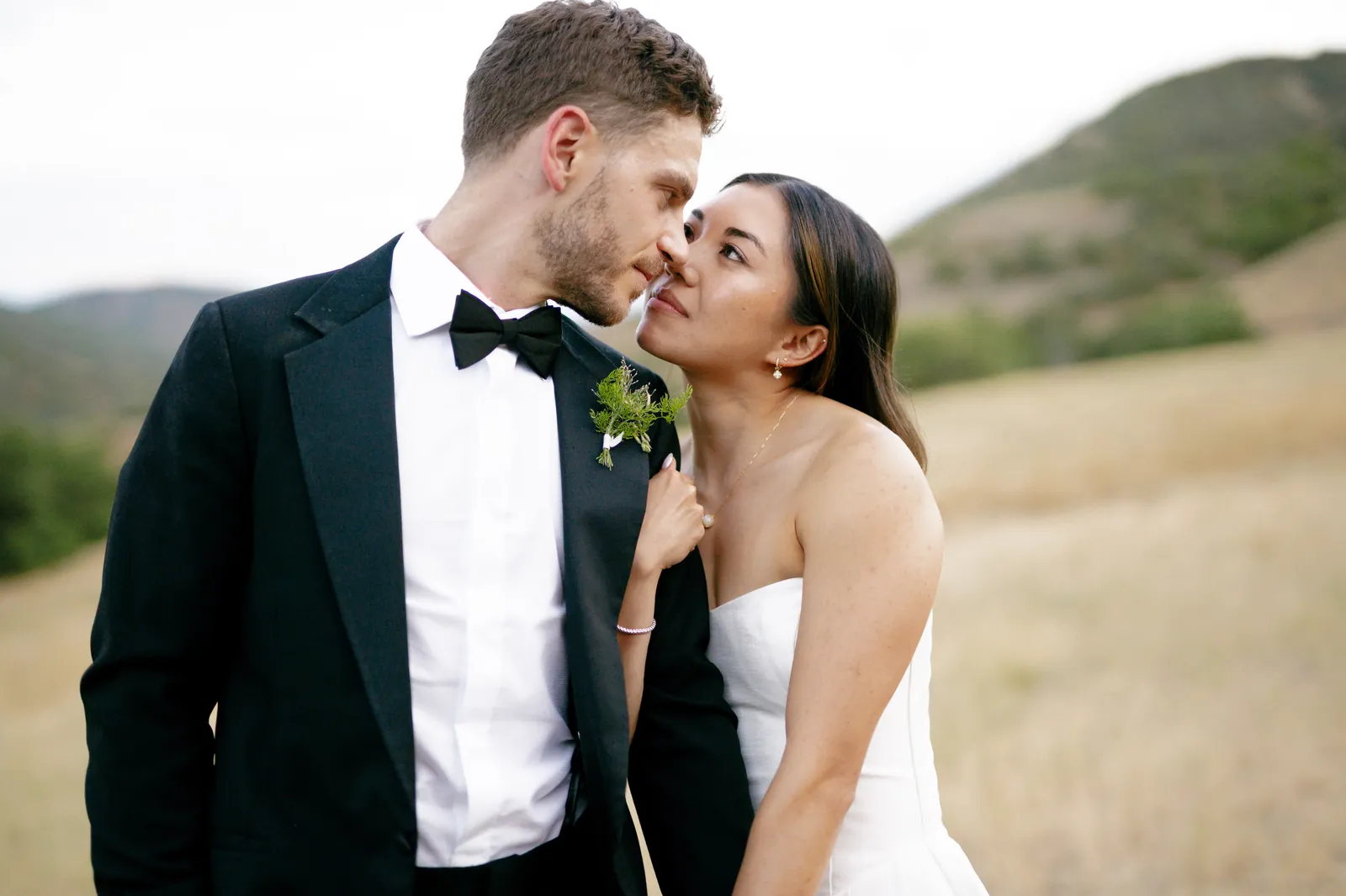 Newlyweds entering their reception hand in hand