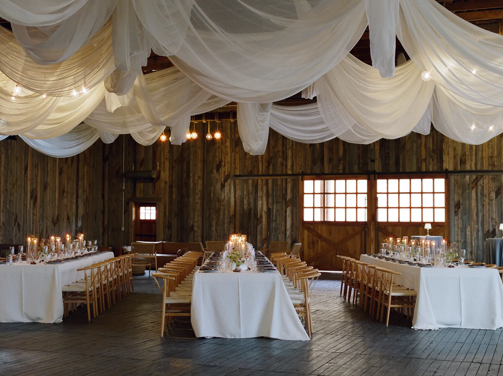 Reception hall dressed in ivory drapes ready for guests